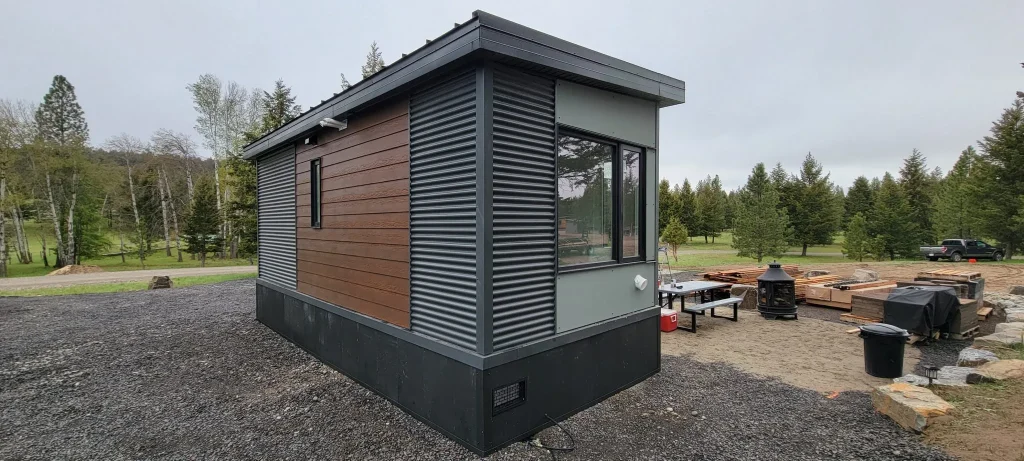 Accessory building with large windows and wooden accents